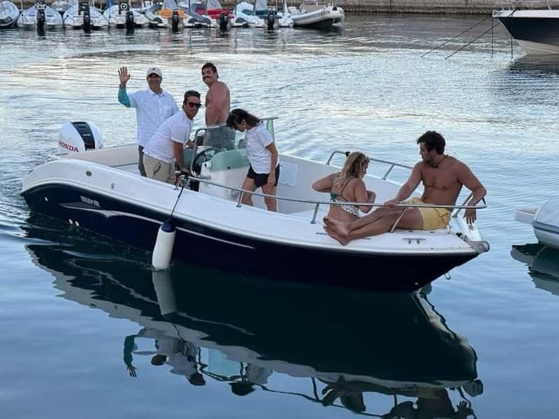 Aperitif on a boat at sunset at the Queen Cave - Cruising to Arenella Bay for the last light