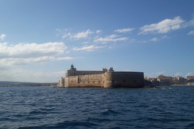 Boat Excursion to Ortigia with Typical Homemade Lunch - Ortigia circumnavigation: the monuments look different from water level