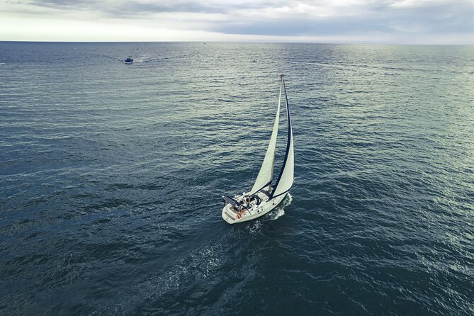Catania: Sail Cyclops Coast by Boat and Enjoy a Sicilian Aperitif - The coastal views at Aci Castello: Ulisse’s Caves and the Norman castle from the sea