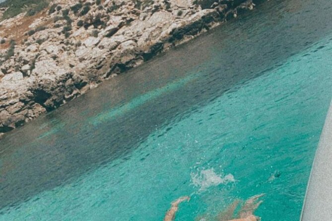Egadi Islands Boat Tour: Favignana and Levanzo with Lunch - Favignana Swim Coves: Red Cliffs, Blue Water, and a Welcome Drink