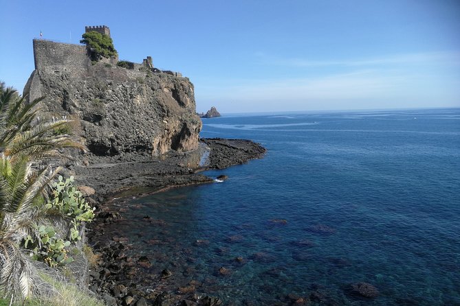 Etna tour Full day - Aci Castello: walking on lava rock history