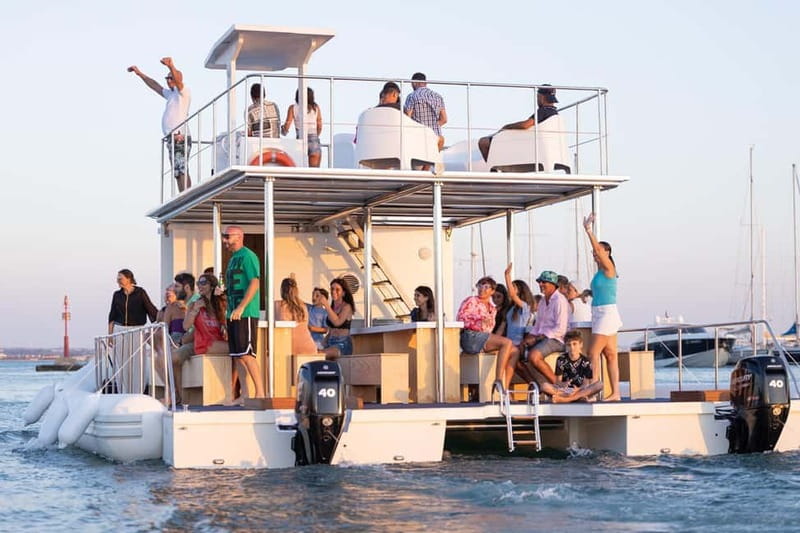 Giardini Naxos: Dolphin Catamaran Sunset Tour with Aperetif - The coastal route: caves, capes, and the Taormina shoreline