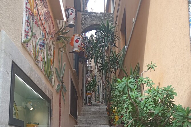 Half-day tour to Taormina, Castelmola and Isola Bella - Castelmola’s sea terrace: ceramics, Norman ruins, and the almond stop