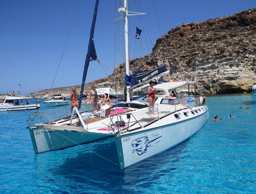 Lampedusa: Dolphin watching with aperitif at sunset - Dolphin Chasing at Golden Hour: What You Do on the Water