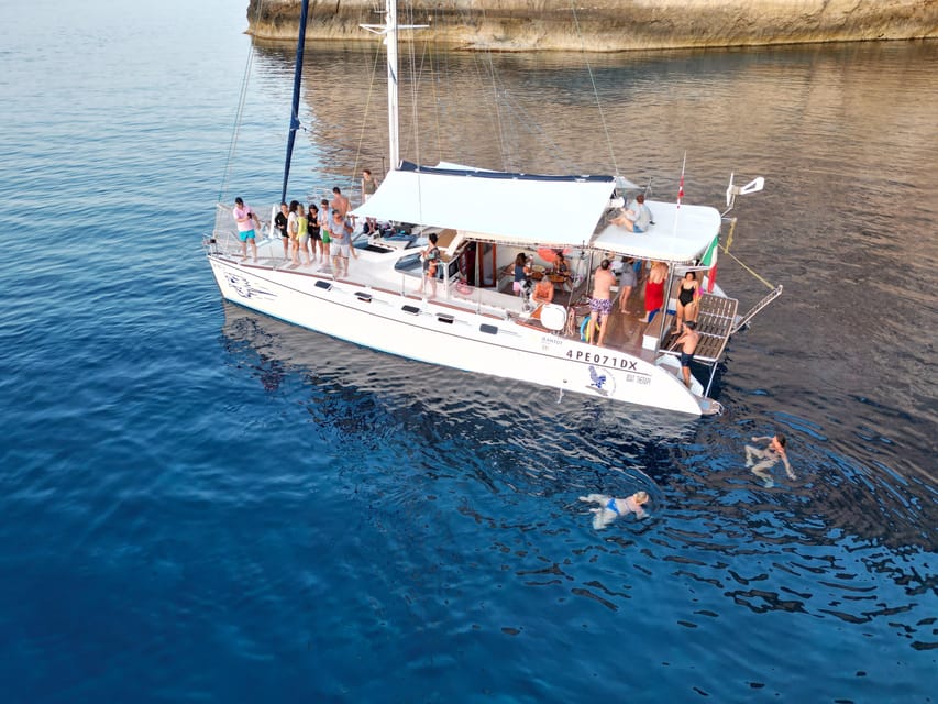 Lampedusa: Dolphin watching with aperitif at sunset - Sunset Aperitif: Cocktail, Island Appetizers, and Toasting Together