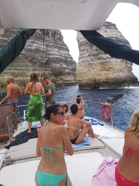 Lampedusa: Yacht excursion, swimming stops and typical lunch - Caves, Madonna Rock, and stacks you pass close by