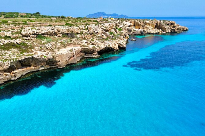One Day Guided Boat Tour in Trapani with Snorkeling - The cave of Lovers stop: fishermen boats and torches