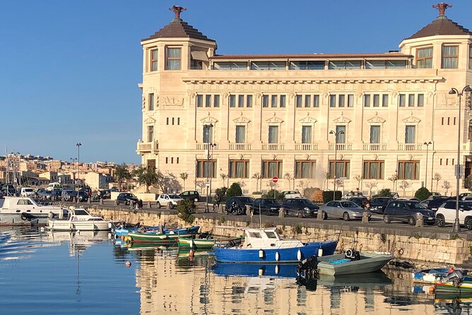Private boat tour 1h Ortigia and caves with tales - English guide, mobile ticket, and a meeting point that won’t waste your day