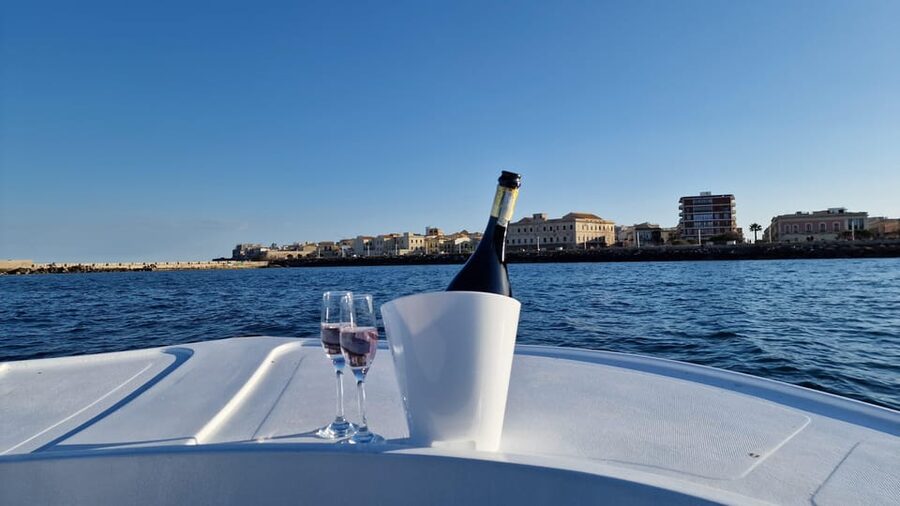 Siracusa: Ortigia & Sea Caves Boat Tour with Sunset Apertif - From A Surgiva to Ortigia at golden hour