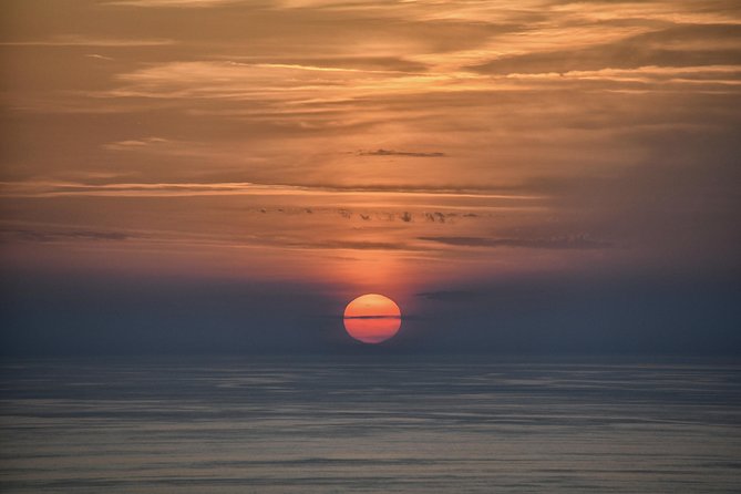 Stromboli: sunset trekking to Sciara del Fuoco - Ashàra - The Sciara del Fuoco viewpoint: sunset turns the island red