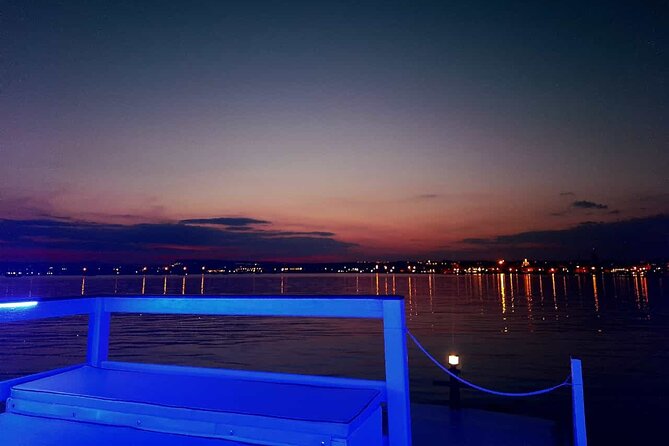 Sunset boat tour with aperitif and swimming break - The Ortigia circumnavigation: Cathedral views, bridge lines, and waterfront character