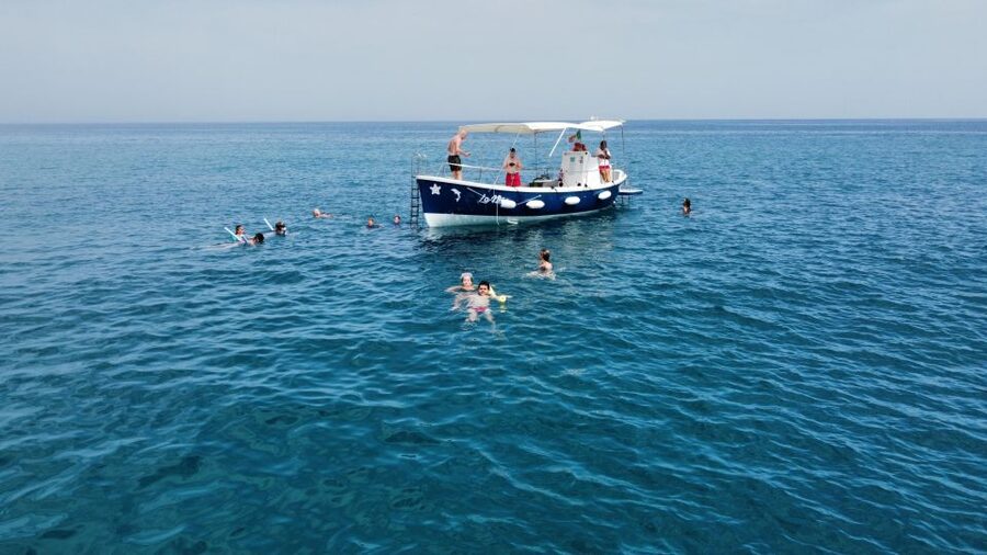 Sunset excursion by boat along the coast of Cefalù - The boat setup: easy entry, shade vs sun, and masks for the seabed