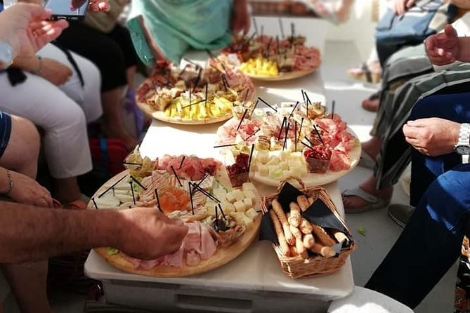 Syracuse Aperitif boat at Sunset island and sea caves - Grotta del Corallo: seeing soft red coral inside the cave walls