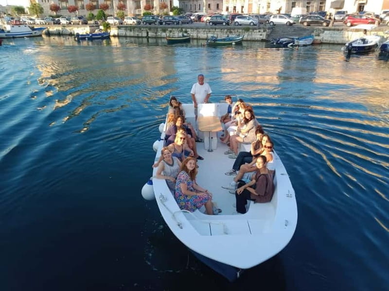 Syracuse: Ortigia Island and Sea Caves Boat Tour with Drinks - Porta Marina and the end toast: how the tour finishes
