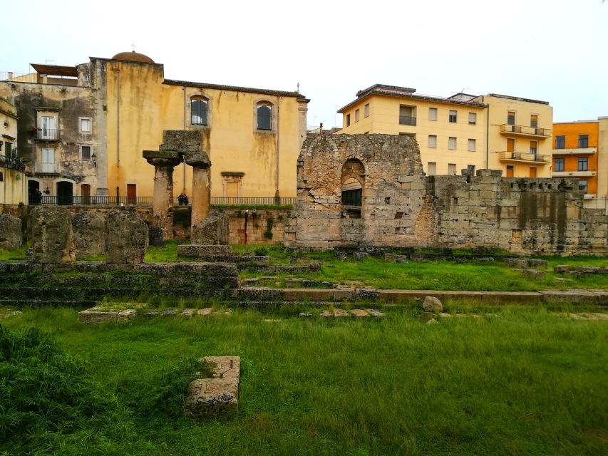 Syracuse: Ortygia & Neapolis Archaeological Park Guided Tour - Moving to Neapolis: from a church doorway to Roman water systems