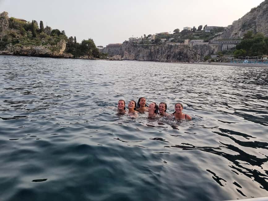 Taormina: Sunset Boat Tour with Aperitif - Dolphins, music, and the guide who changes the mood